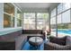 Relaxing sunroom with wicker furniture, including a sofa and chairs, perfect for enjoying outdoor views at 2165 Annie Laura Ln, Mount Pleasant, SC 29466