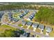 This aerial view shows a well-planned community with tree-lined streets and meticulously landscaped yards at 223 Sugarberry Lane, Moncks Corner, SC 29461