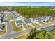 This aerial view captures a suburban neighborhood featuring a variety of home styles and manicured lawns at 223 Sugarberry Lane, Moncks Corner, SC 29461