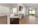 Open kitchen with granite countertops, stainless steel appliances, and breakfast bar at 223 Sugarberry Lane, Moncks Corner, SC 29461