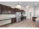 Bright kitchen featuring stainless steel appliances, granite countertops, and breakfast bar at 223 Sugarberry Lane, Moncks Corner, SC 29461