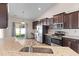 Modern kitchen featuring granite countertops, stainless steel appliances, and sliding doors to patio at 223 Sugarberry Lane, Moncks Corner, SC 29461