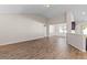 Hardwood floors, neutral walls, and a seamless transition into the dining area define this bright and spacious living room at 223 Sugarberry Lane, Moncks Corner, SC 29461