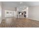 Bright and spacious living area with hardwood floors, neutral paint, seamlessly flowing into the kitchen and dining areas at 223 Sugarberry Lane, Moncks Corner, SC 29461
