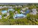 Attractive aerial view of the lakefront condominium community boasting lush landscaping and marsh views at 2472 Racquet Club Dr, Seabrook Island, SC 29455
