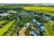Aerial view of a condo on a lake surrounded by trees, marshlands and other neighborhood homes at 2472 Racquet Club Dr, Seabrook Island, SC 29455