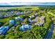 Aerial view of the building on a lake and the surrounding marshlands and other townhomes at 2472 Racquet Club Dr, Seabrook Island, SC 29455
