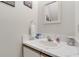 Clean bathroom featuring a vanity with a white marble countertop at 2472 Racquet Club Dr, Seabrook Island, SC 29455