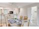 Dining area featuring a stylish table setting and natural light, adjacent to the kitchen area at 2472 Racquet Club Dr, Seabrook Island, SC 29455