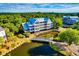 Exterior view of the condo building with water, trees and a bridge at 2472 Racquet Club Dr, Seabrook Island, SC 29455