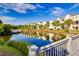 Waterfront property with beautiful reflections, landscaping and exterior balconies under a bright sky at 2472 Racquet Club Dr, Seabrook Island, SC 29455