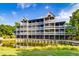 Exterior view of a building on the lake with a porch view of the property at 2472 Racquet Club Dr, Seabrook Island, SC 29455