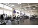 Well-equipped fitness center with modern cardio machines, free weights, and ample natural light for residents at 2472 Racquet Club Dr, Seabrook Island, SC 29455