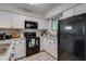 Bright kitchen with white cabinets, modern appliances, and a cozy coffee bar setup at 2472 Racquet Club Dr, Seabrook Island, SC 29455