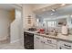 Well-designed kitchen area with granite countertops and modern amenities adjacent to the staircase at 2472 Racquet Club Dr, Seabrook Island, SC 29455