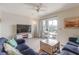 Comfortable living room with two sofas, a coffee table, and access to the balcony at 2472 Racquet Club Dr, Seabrook Island, SC 29455