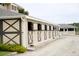 Stables for horses in equestrian community feature stalls with views; lush landscaping at 2472 Racquet Club Dr, Seabrook Island, SC 29455