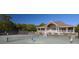 Players enjoy a friendly tennis match on a well-maintained court next to a charming clubhouse at 2472 Racquet Club Dr, Seabrook Island, SC 29455