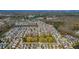 Expansive aerial view of a planned community with tree-lined streets and manicured green spaces at 2842 Rutherford Way, Charleston, SC 29414