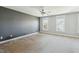 Large bedroom with a gray accent wall, windows, and plush carpeting at 2842 Rutherford Way, Charleston, SC 29414