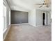 Spacious bedroom with carpet, ceiling fan, gray accent wall and lots of natural light at 2842 Rutherford Way, Charleston, SC 29414