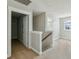 Hallway with neutral walls, carpet, and access to rooms with natural light from windows at 2842 Rutherford Way, Charleston, SC 29414