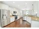 Well-lit kitchen with stainless steel appliances, granite countertops, and white cabinetry at 2842 Rutherford Way, Charleston, SC 29414