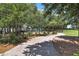Playground within a community park with a curved sidewalk and shade trees at 2842 Rutherford Way, Charleston, SC 29414