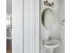 Modern powder room features a pedestal sink, framed mirror, and stylish lighting fixtures at 2842 Rutherford Way, Charleston, SC 29414