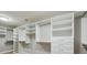 Bright walk-in closet with custom organizers offering many shelves and drawers at 2842 Rutherford Way, Charleston, SC 29414