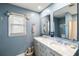 Bright bathroom with double vanity, marble countertop, dual sinks and a large mirror at 2899 Doncaster Dr, Charleston, SC 29414