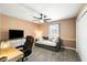 Bedroom with a bed, desk, and TV. A dark ceiling fan adds style to this space at 2899 Doncaster Dr, Charleston, SC 29414