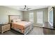 Comfortable bedroom featuring neutral walls, ceiling fan and a queen bed with wood frame at 2899 Doncaster Dr, Charleston, SC 29414