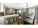 Modern kitchen features a large island, pendant lighting, and a dining area at 2899 Doncaster Dr, Charleston, SC 29414