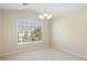 Bright bedroom with a chandelier and view out the window at 2920 Woodland Park Dr, Mount Pleasant, SC 29466