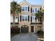 Charming townhome with a garage, front door, and a well-maintained landscaped yard at 2920 Woodland Park Dr, Mount Pleasant, SC 29466