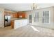 A well-lit kitchen and living room with an open concept design at 2920 Woodland Park Dr, Mount Pleasant, SC 29466