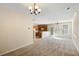 Spacious living room featuring plush carpeting, neutral walls, and a chandelier at 2920 Woodland Park Dr, Mount Pleasant, SC 29466