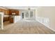 Open-concept living room with plush carpeting, and a seamless flow into the kitchen at 2920 Woodland Park Dr, Mount Pleasant, SC 29466