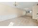 Spacious living room featuring plush carpeting, neutral walls, with access to kitchen and stairs at 2920 Woodland Park Dr, Mount Pleasant, SC 29466