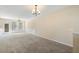 A well-lit living room featuring plush carpeting, and natural light through the windows at 2920 Woodland Park Dr, Mount Pleasant, SC 29466