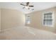Expansive primary bedroom with vaulted ceiling, two windows, and comfortable carpeting at 2920 Woodland Park Dr, Mount Pleasant, SC 29466