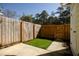 Fenced backyard with a concrete patio and a small, well-manicured lawn area for outdoor relaxation at 2926 Sugarberry Lane Ln, Johns Island, SC 29455