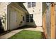 Cozy backyard with a small lawn area, a wooden fence, and string lights for outdoor enjoyment at 2926 Sugarberry Lane Ln, Johns Island, SC 29455