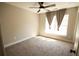 Bedroom boasting neutral walls, carpet flooring, a ceiling fan, and natural light at 2926 Sugarberry Lane Ln, Johns Island, SC 29455