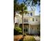 Charming yellow two-story townhome with a white pergola and well-maintained landscaping at 2926 Sugarberry Lane Ln, Johns Island, SC 29455
