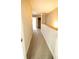 Upstairs hallway with beige carpet, wood railing and view of a closet at 2926 Sugarberry Lane Ln, Johns Island, SC 29455