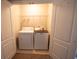 Brightly lit laundry closet with full-sized washer and dryer at 2926 Sugarberry Lane Ln, Johns Island, SC 29455
