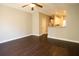 Spacious living room features hardwood floors, ceiling fan, and an opening to the kitchen at 2926 Sugarberry Lane Ln, Johns Island, SC 29455