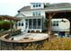 Expansive backyard with a custom kitchen, a fire pit with seating and a screened in porch with access stairs at 2961 Yachtsman Dr, Mount Pleasant, SC 29466